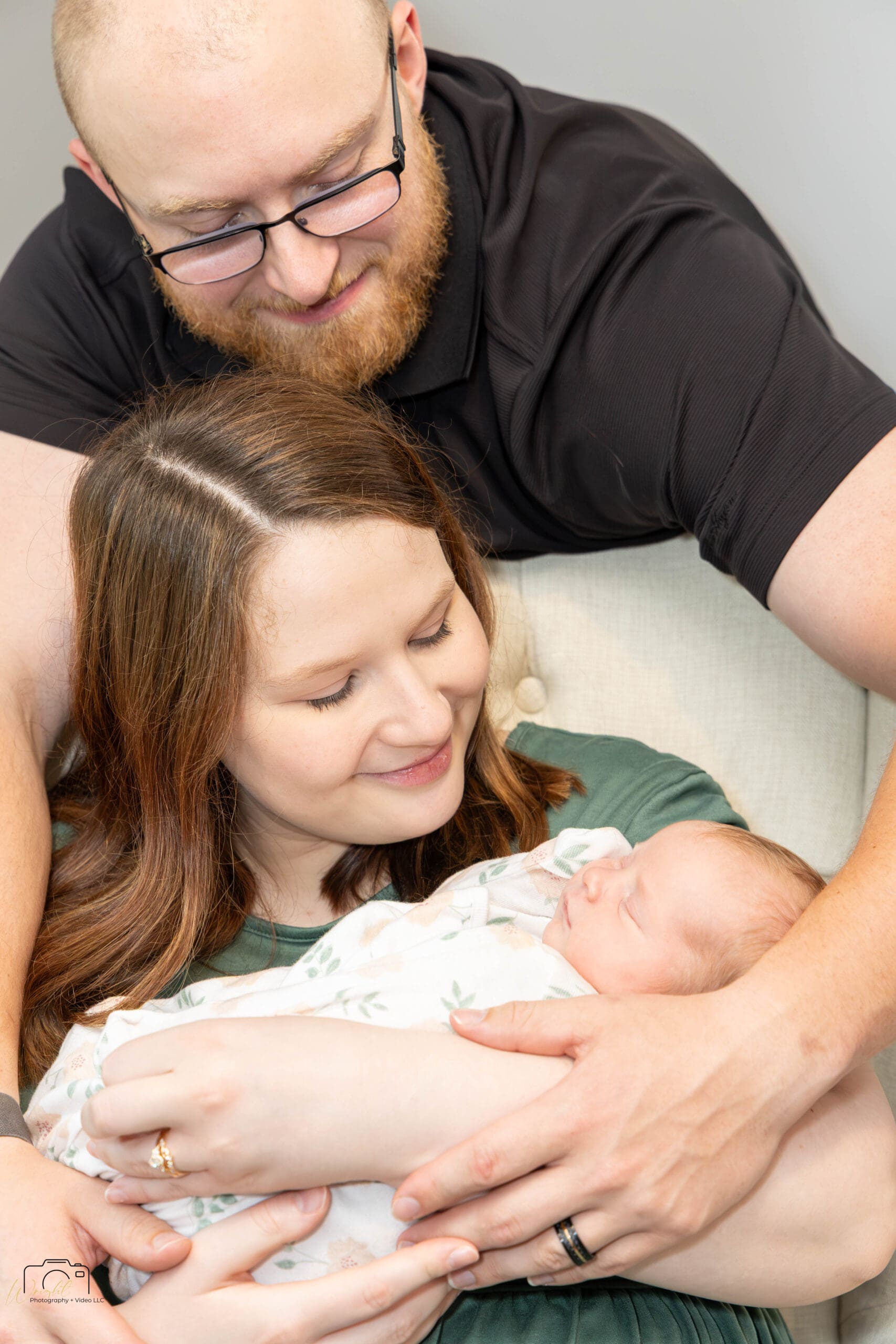 Gage kissing Emily's head as she cradles Amelia