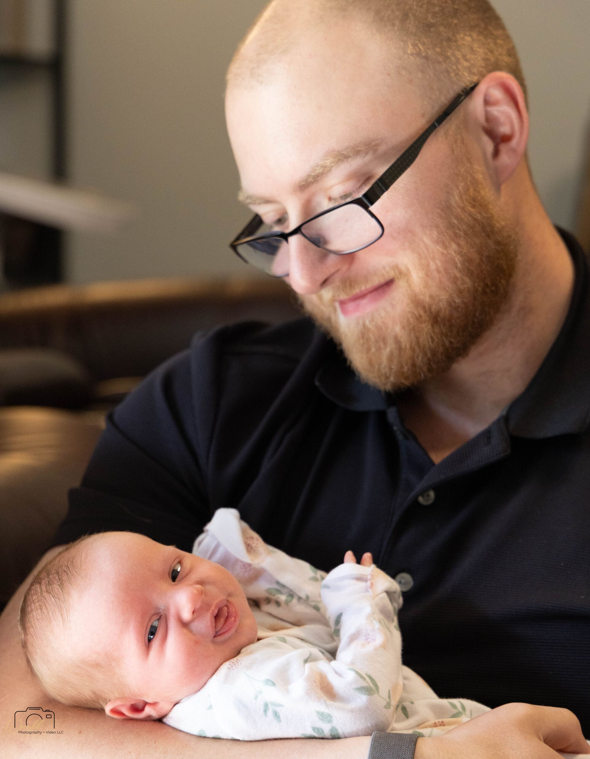 Gage with baby Amelia at home