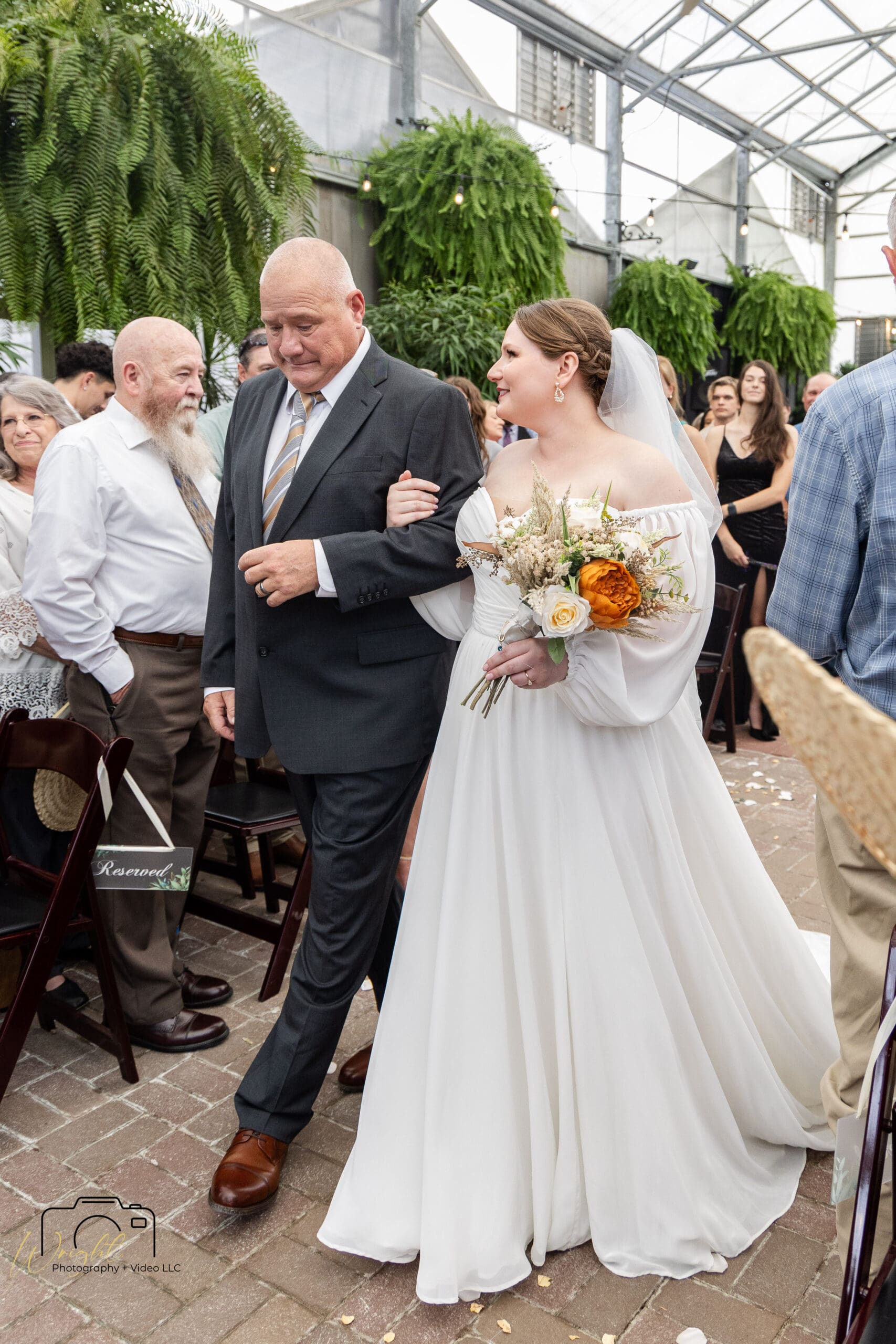 Emily's parents during the ceremony