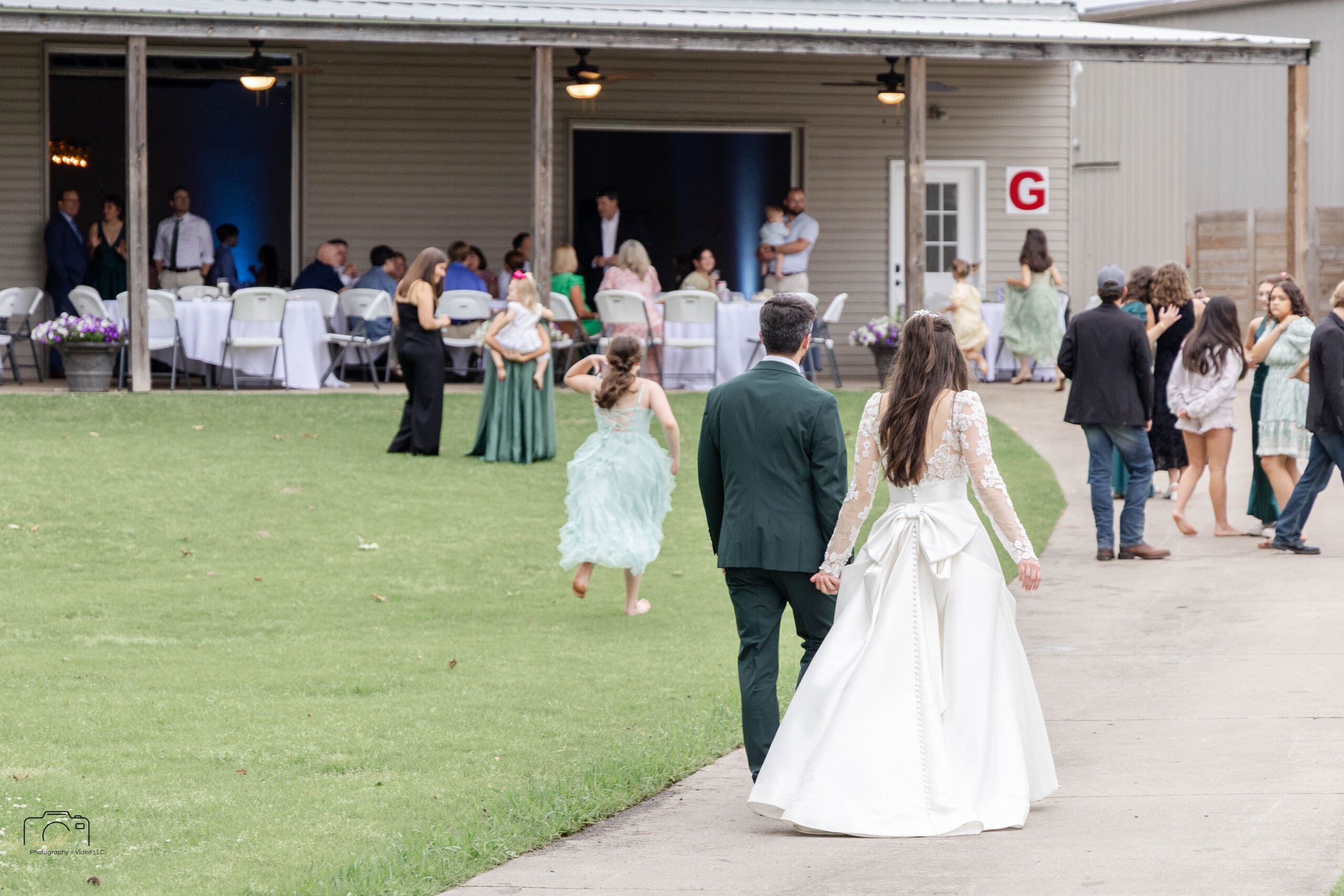 Ryan and Elizabeth walking back to their guests as the night continues