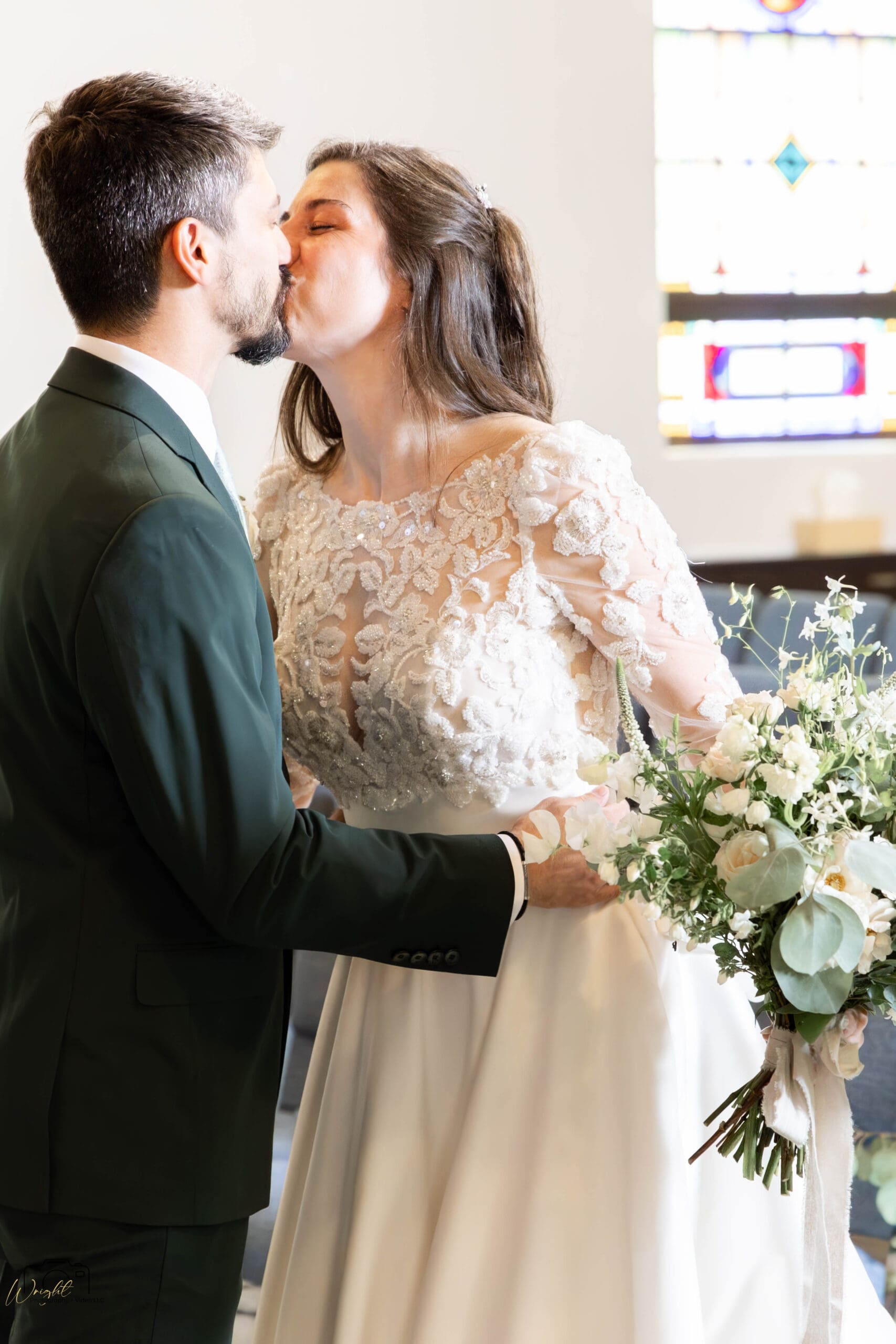 Elizabeth and Ryan sharing a tender kiss during their first-look reveal