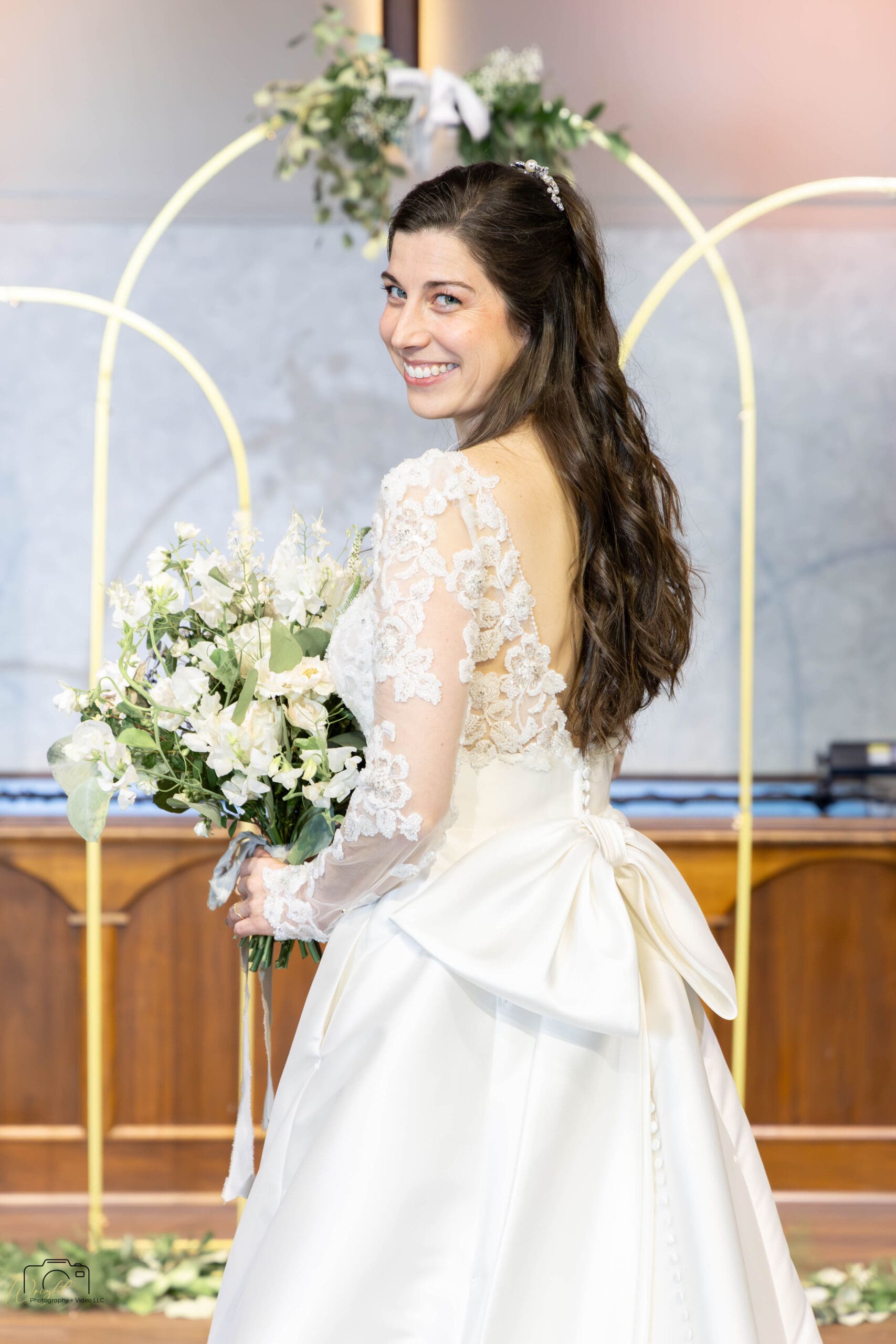 Detail of Elizabeth's oversized satin bow and gown train