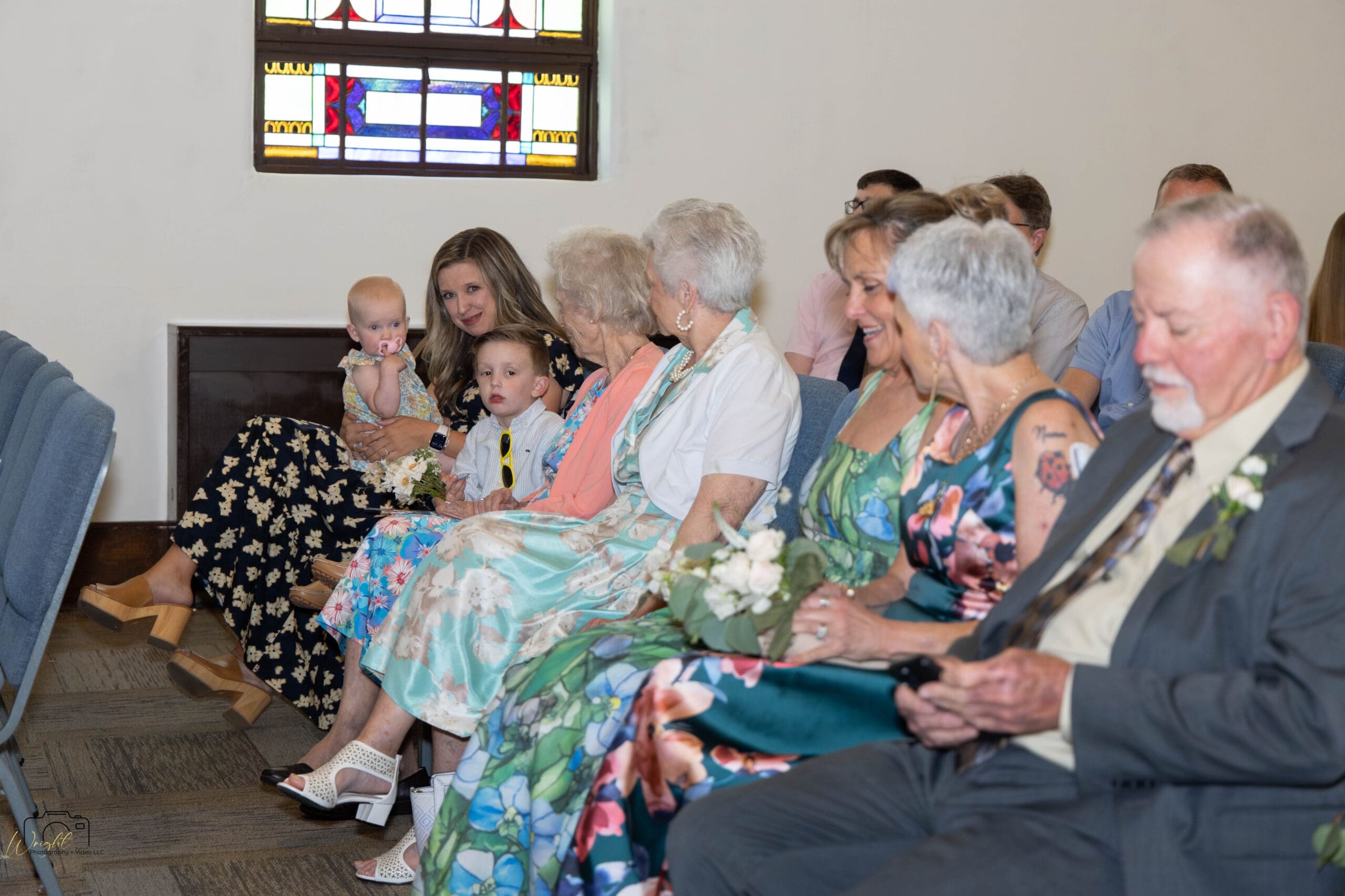 Family members finding their seats of honor in the front rows