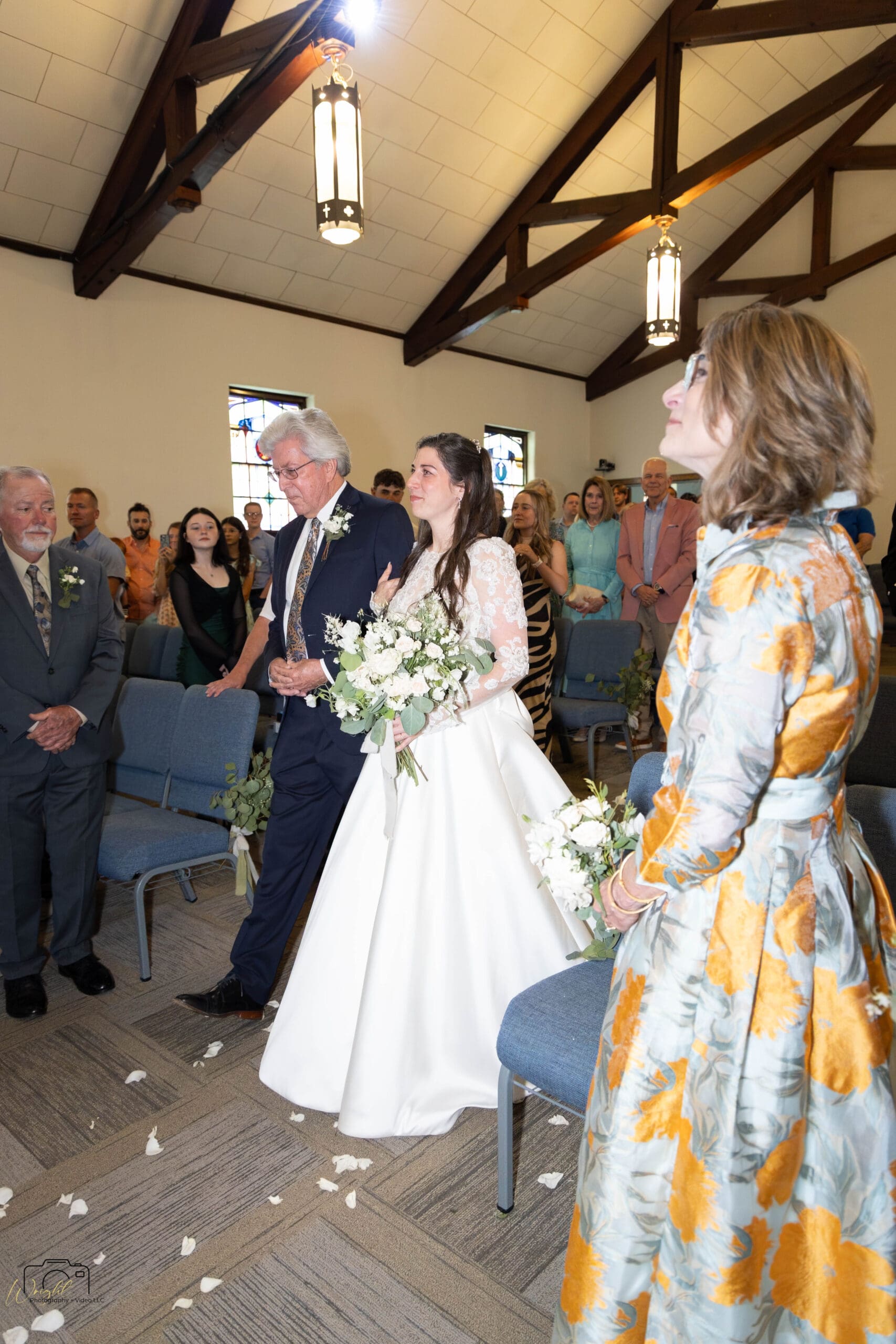 Elizabeth walking down the aisle with her father