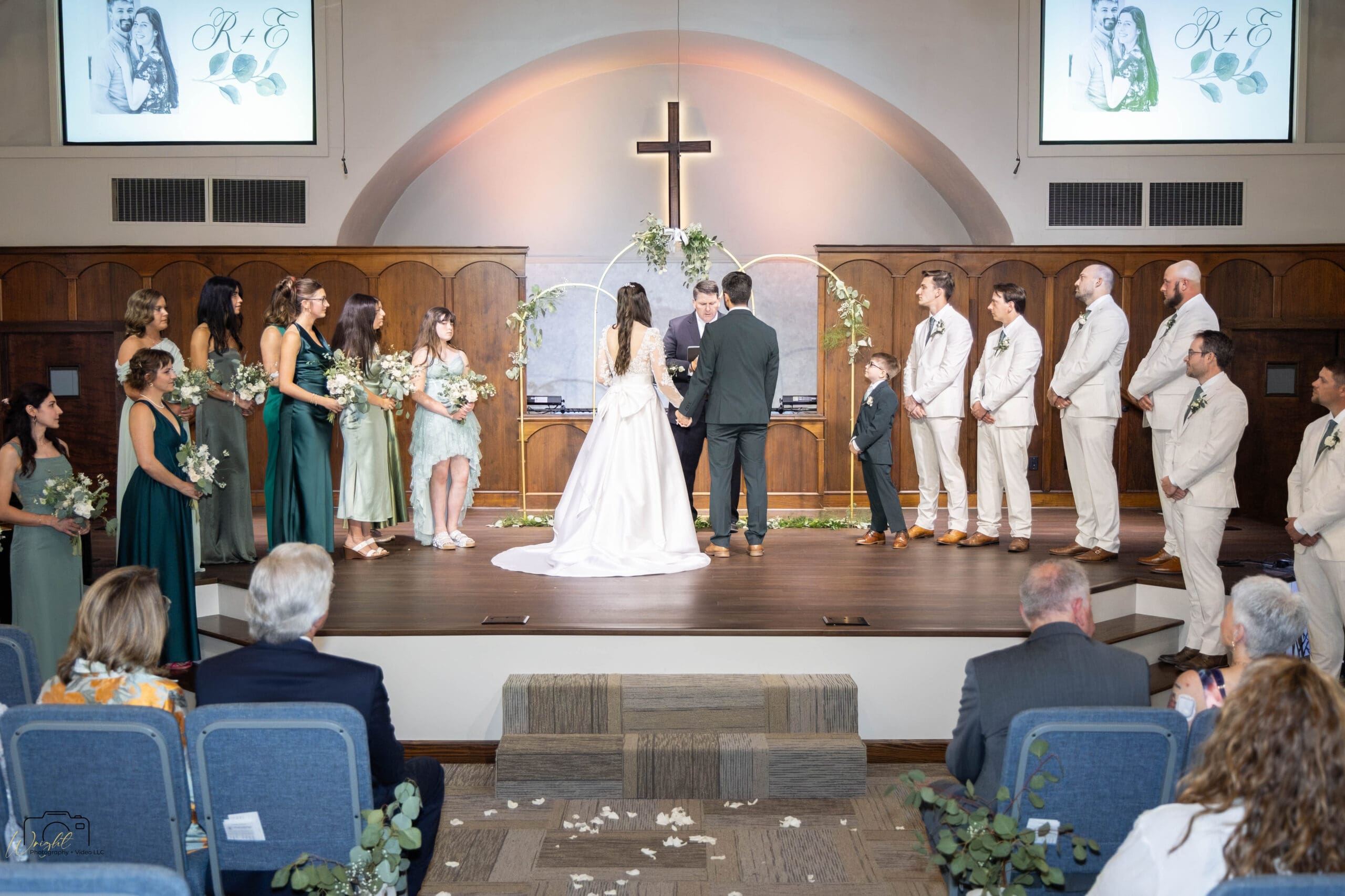 Ryan and Elizabeth with their wedding party at the altar