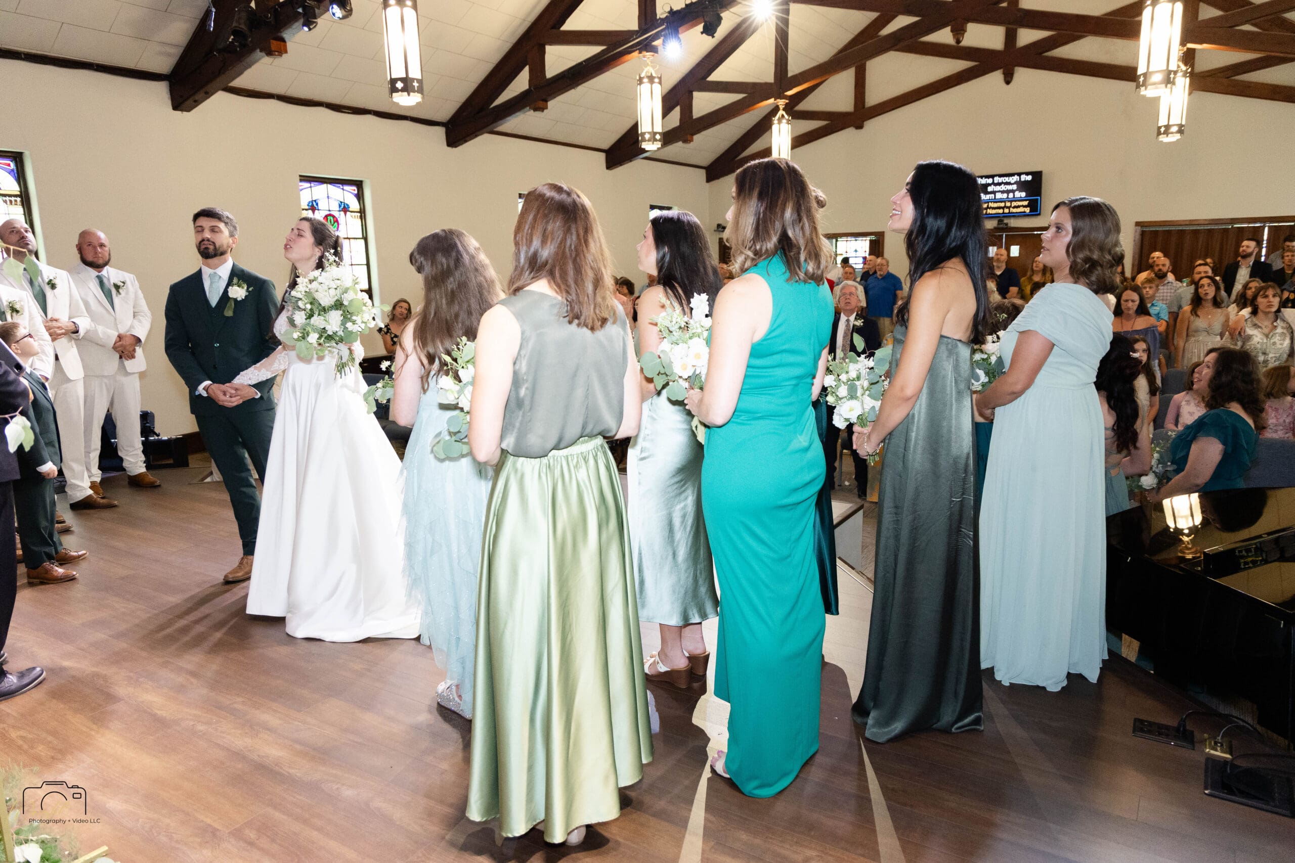 Guests standing in worship during the ceremony