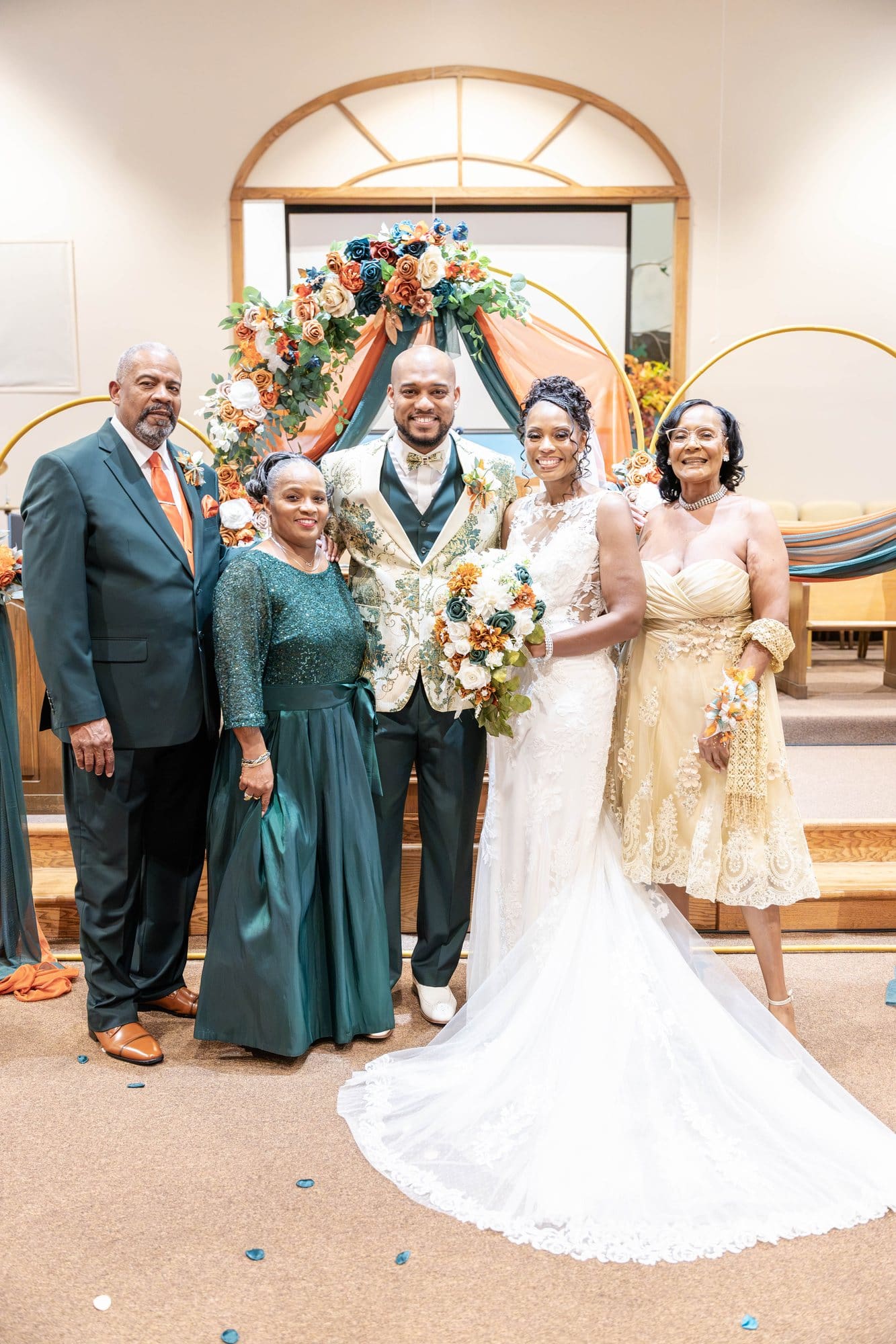 David and Nikeesha with their families at the altar of Mount Moriah Missionary Baptist Church