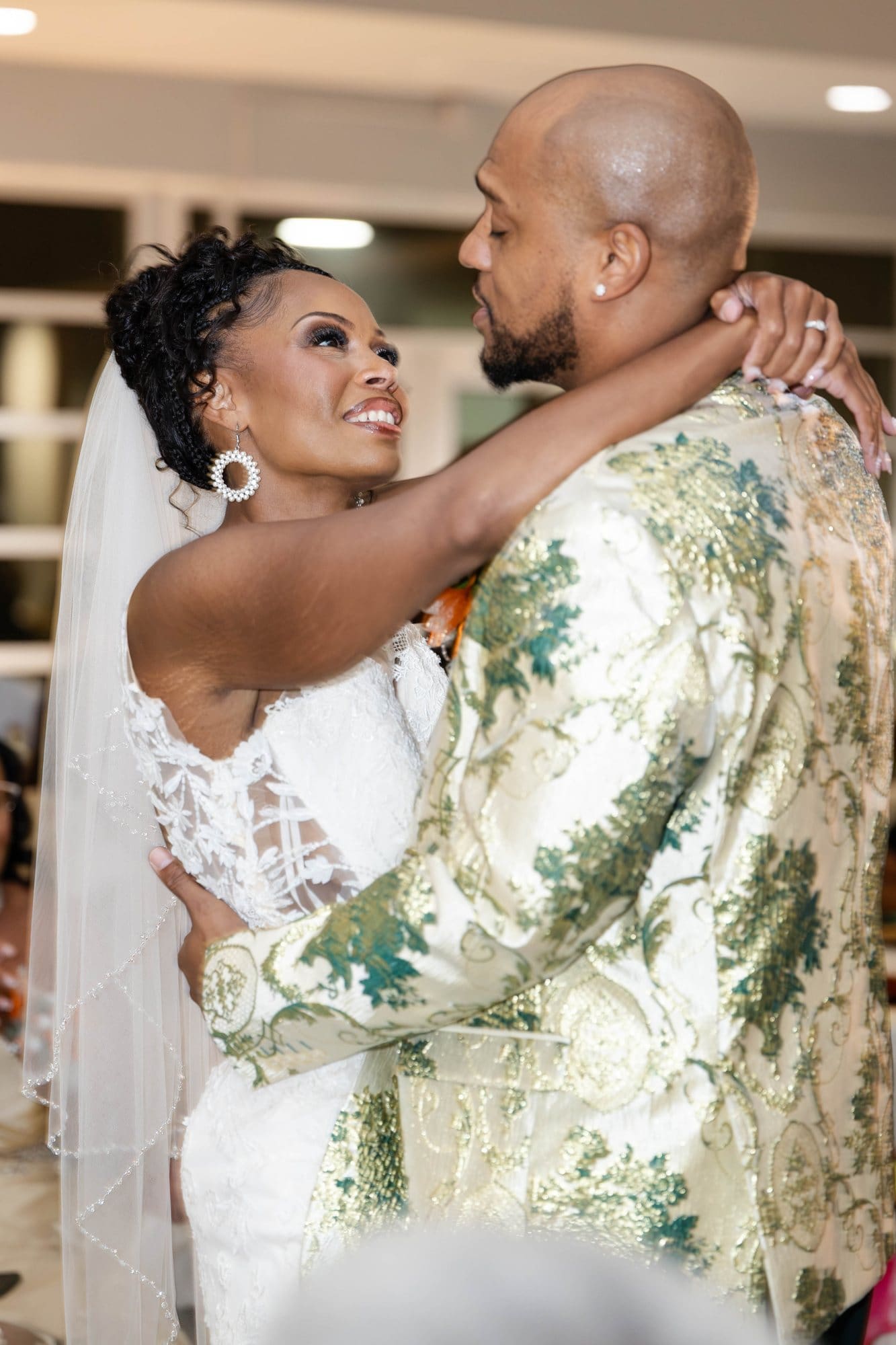 David and Nikeesha sharing their first dance as husband and wife, gazing at each other
